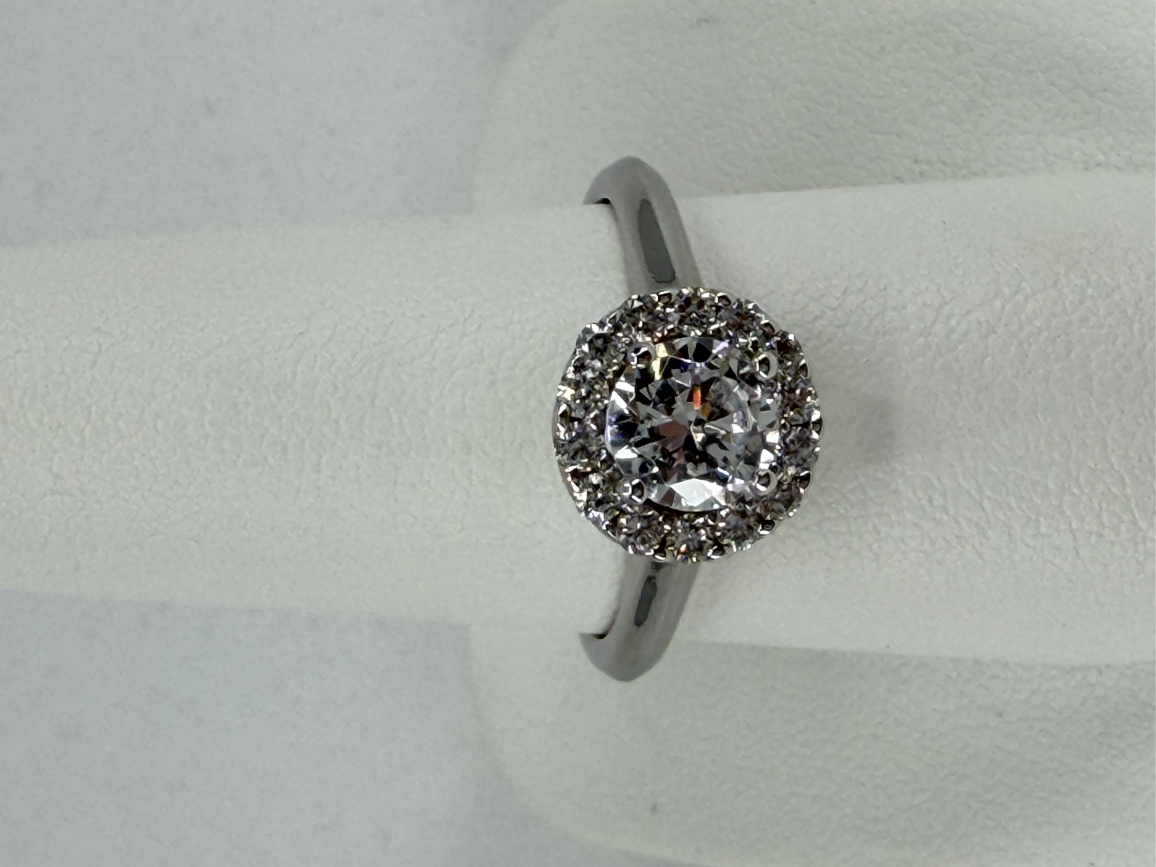 18 Karat White Gold Flower Ring With 1 Cubic Zirconia = 0.75 Carats and 14 Natural Diamonds = 0.30 Carats