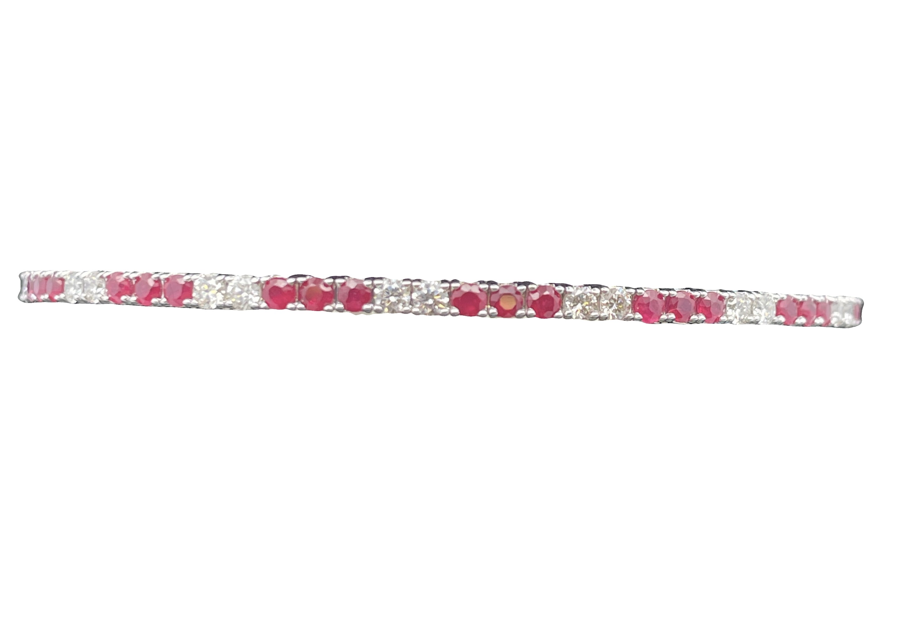 1.84TGW RUBY AND DIAMOND FLEX BANGLE CONTAINING: 21 ROUND RUBIES 1.03CTW + 16 ROUND DIAMONDS .81TDW 14KW