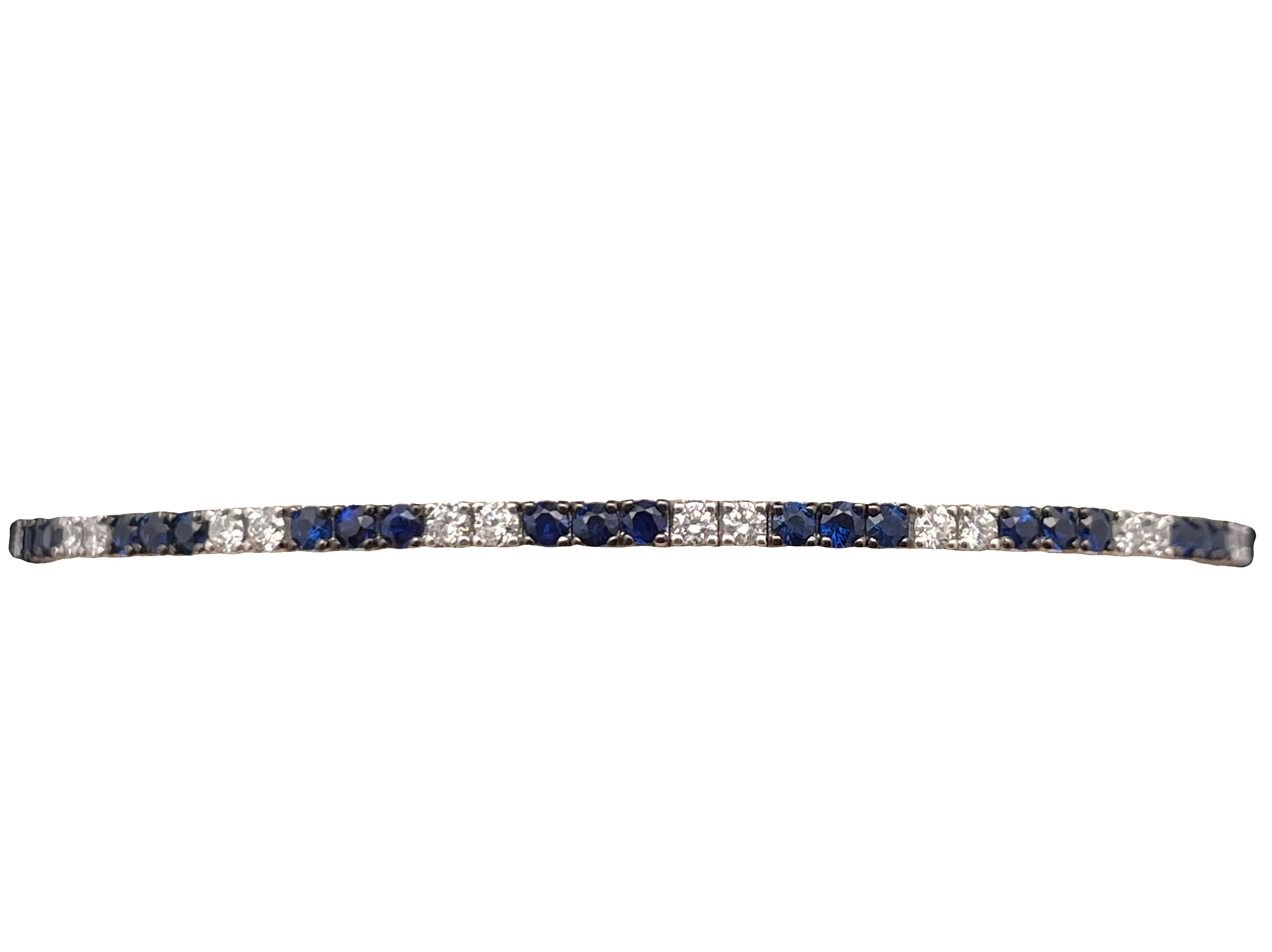 1.33TGW SAPPHIRE + DIAMOND FLEX BANGLE BRACELET CONTAINING: 25 ROUND BLUE SAPPHIRES .92CTW + 16 ROUND DIAMONDS .41TDW 14KW