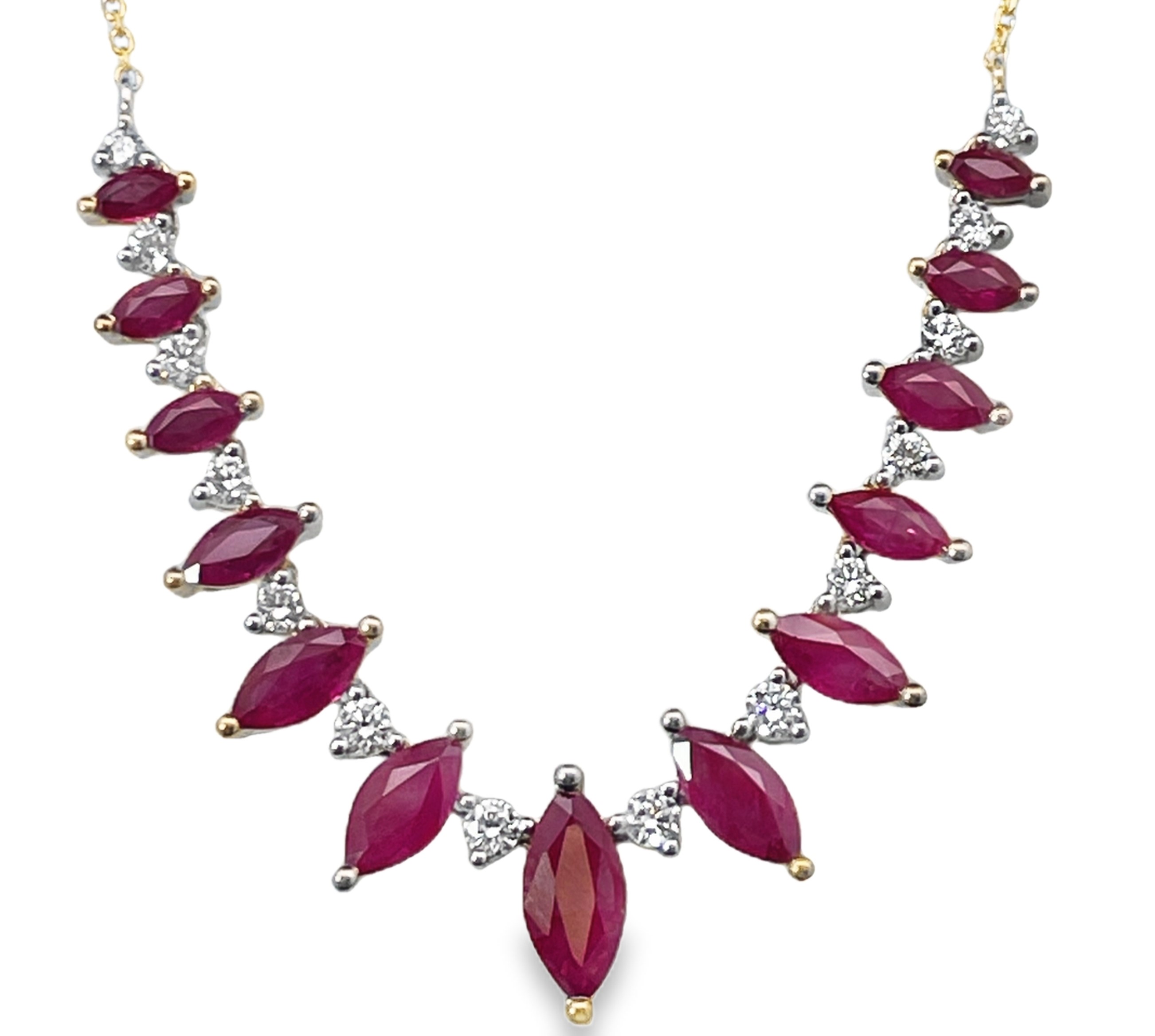 6.87TGW RUBY AND DIAMOND CENTER NECKLACE CONTAINING: 13 MARQUISE RUBIES 5.52CTW ALTERNATING WITH 14 ROUND DIAMONDS 1.35TDW 14KY