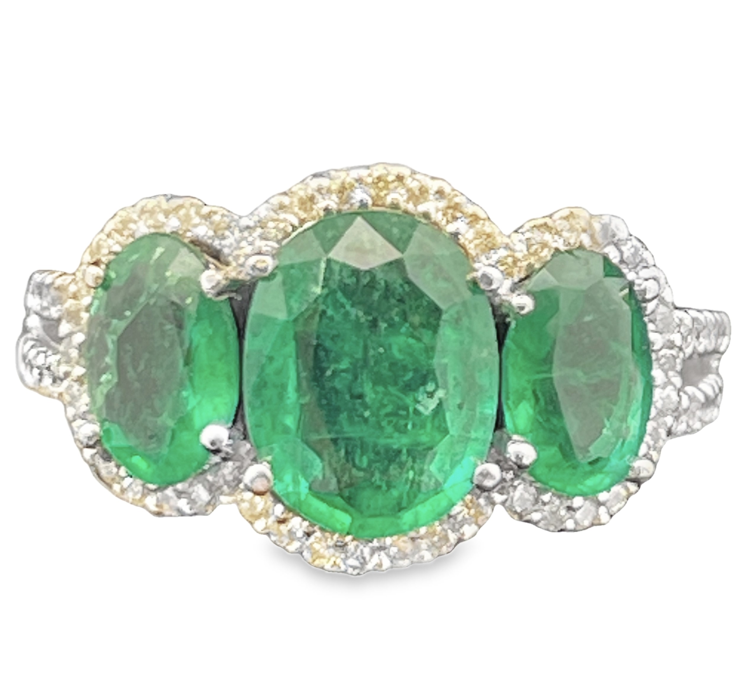 4.57TGW EMERALD + DIAMOND 3-STONE RING CONTAINING: 3 OVAL EMERALDS 4.20CTW + 66 ROUND HALO DIAMONDS .37TDW 14KW