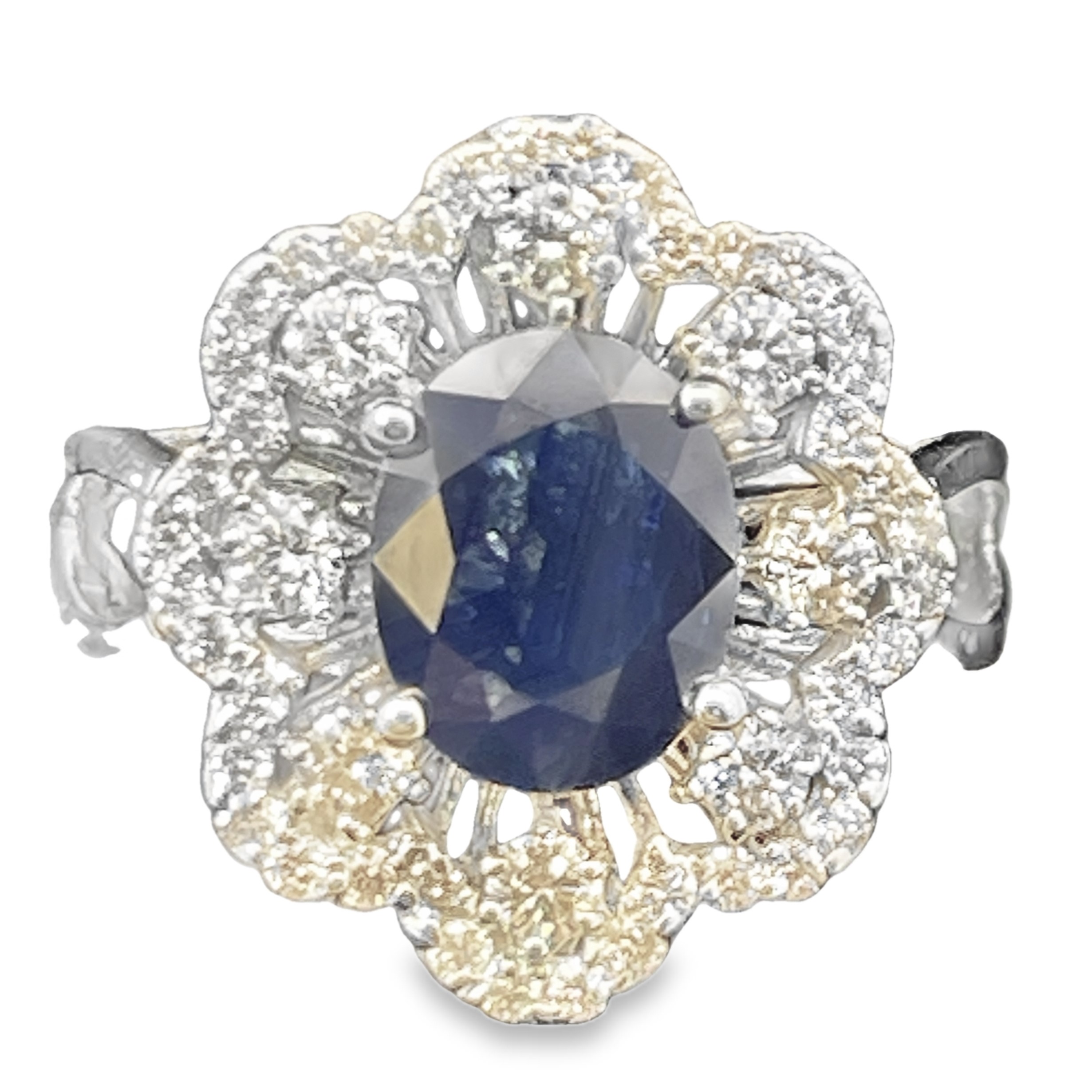2.90TGW SAPPHIRE + DIAMOND SCALLOP-EDGE RING CONTAINING: 2.20CT OVAL BLUE SAPPHIRE CENTER + 48 ROUND HALO DIAMONDS .70TDW 14KW