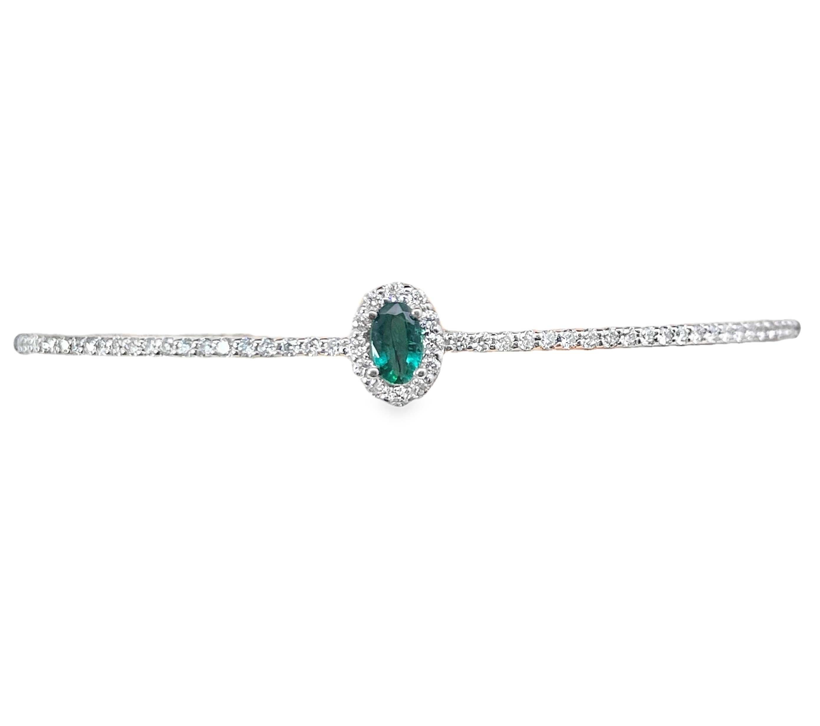 .70TGW EMERALD + DIAMOND HALO HALF-BANGLE WITH CHAIN BRACELET CONTAINING: .25CT OVAL CENTER EMERALD + 56 ROUND DIAMONDS .45TDW 14KW