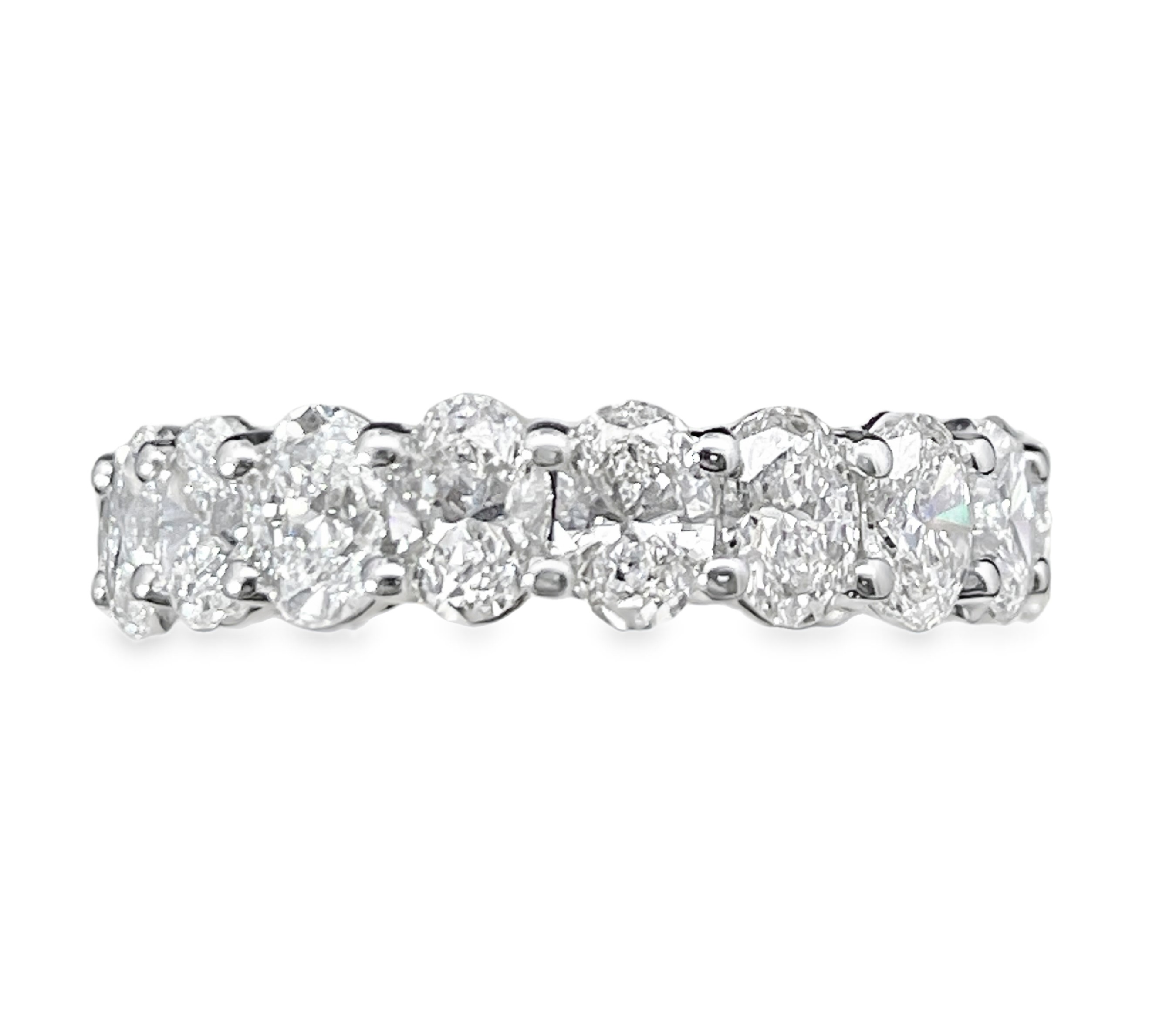 SUPER MAN MADE CREATED 4.75CTW DIAMOND ETERNITY BAND CONTAINING: 19 OVAL DIAMONDS E-F VS 14KW