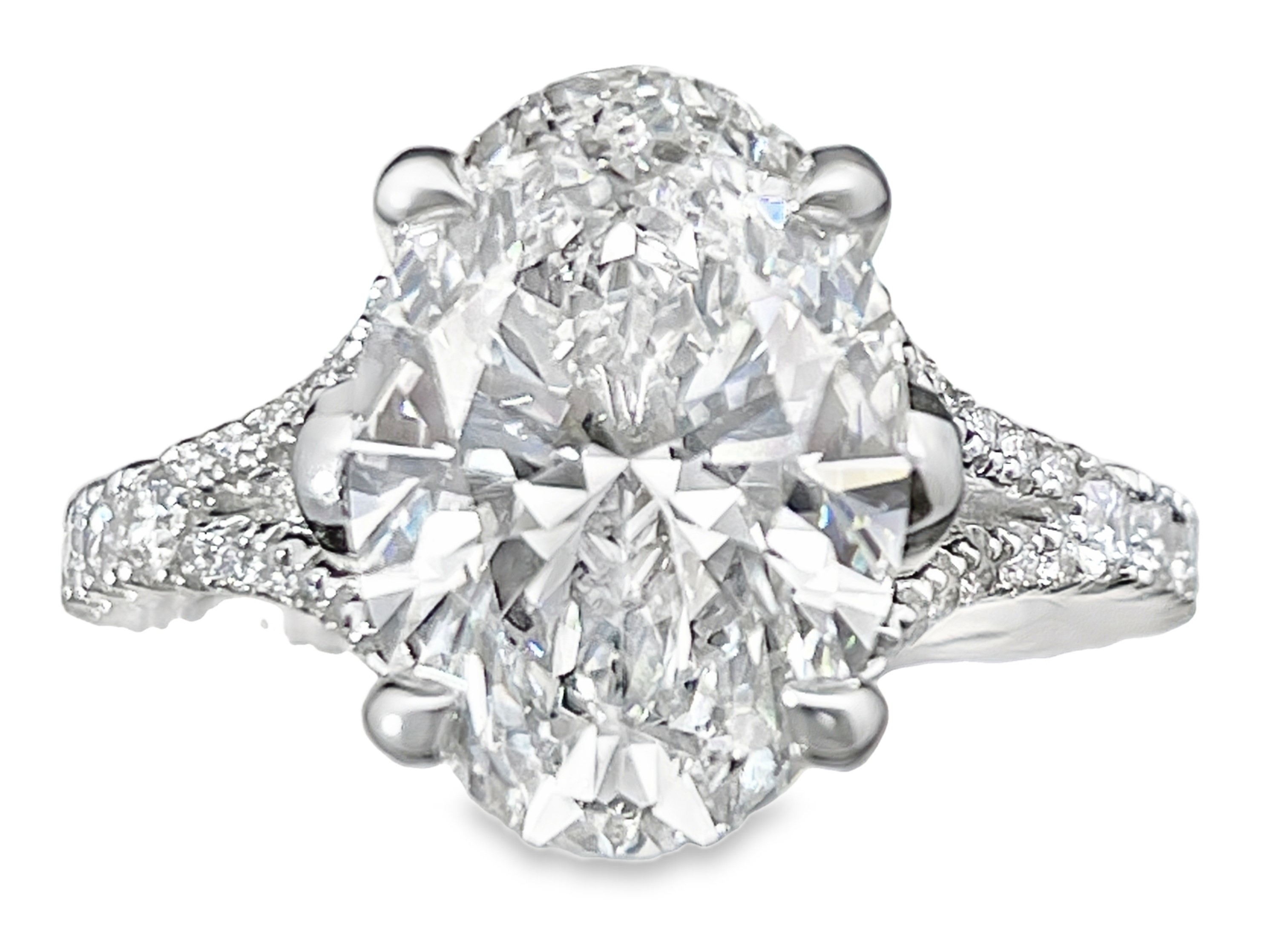 SUPER MAN MADE CREATED 5.65CTW DIAMOND ENGAGEMENT RING CONTAINING: 5.01CT OVAL DIAMOND CENTER G VS2 IGI LG607323056 + 2 BEZEL-SET PEAR SHAPE DIAMONDS + 44 ROUND MELEE DIAMONDS .64CTW 18KW