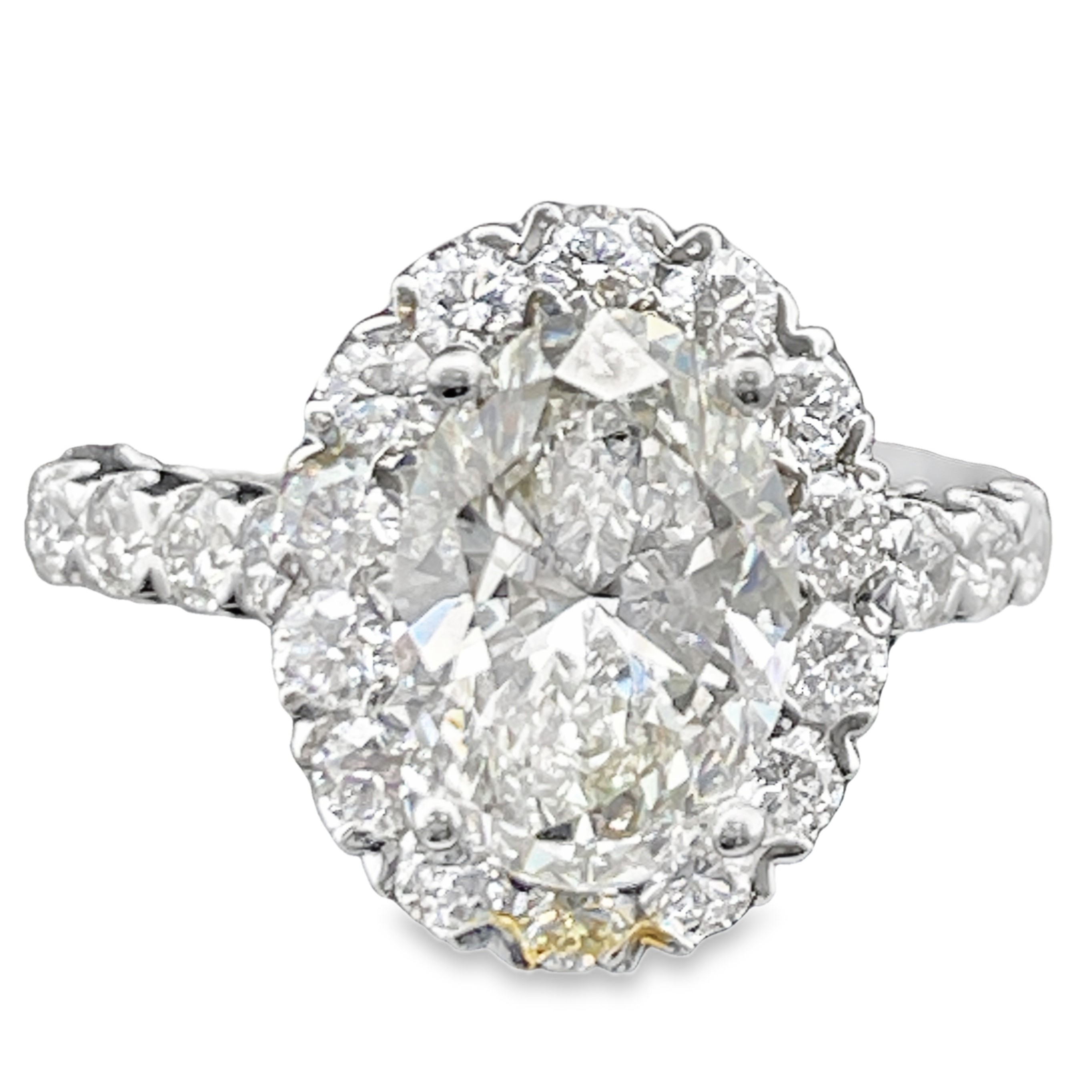 SUPER MAN MADE CREATED 4.36CTW DIAMOND OVAL HALO ENGAGEMENT RING CONTAINING: 3.07CT OVAL DIAMOND CENTER F VS IGI CARD CERT 73J371772510 + 34 ROUND DIAMONDS 1.29CTW E-F VS 14KW