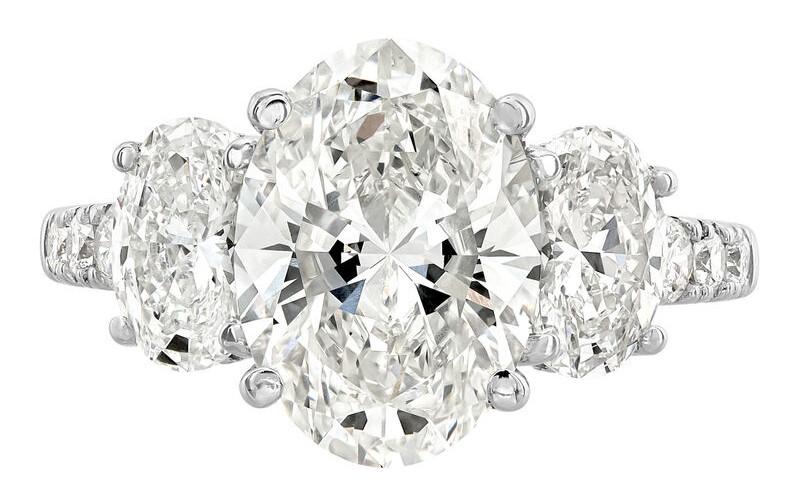 SUPER MAN MADE CREATED 5.53CTW DIAMOND "3-STONE" ENGAGEMENT RING CONTAINING: 3.52CT OVAL DIAMOND CENTER G VS1 IGI LG563201029 + .75CT OVAL DIAMOND D VVS2 IGI LG628455289 + .76CT OVAL DIAMOND D VS1 IGI LG628455288 + 22 ROUND PROFILE MELEE DIAMONDS 1/2CTW 14KW