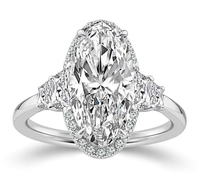 SUPER MAN MADE CREATED OVAL HALO ENGAGEMENT RING CONTAINING: 3.16CT OVAL DIAMOND E VVS2 IGI LG794630859 + 4 TRAPEZOID DIAMONDS + 20 ROUND MELEE DIAMONDS .90CTW 14KW